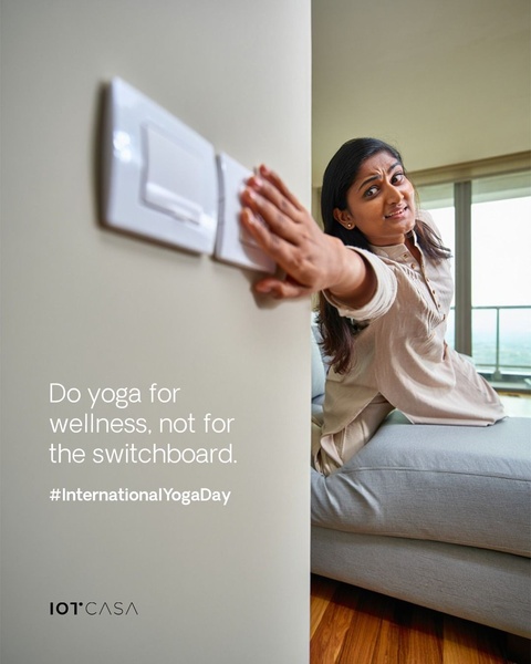 A clever ad using a relatable yoga struggle to emphasize the convenience of touchless or remote lighting control.